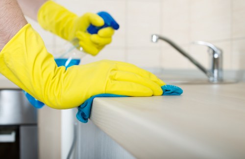 Cleaning staff assessing risks before carpet cleaning