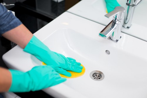 Office cleaners in SE18 sanitising desks and shared spaces